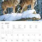 Kalenderblatt 11/2027, zeigt zwei Wölfe auf verschneitem Baumstamm im Wald. Wochentage und Notizbereich sind enthalten.