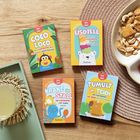 Vier bunte Kartenspielboxen mit den Titeln: "Coco Loco", "Eisdiele", "Krake im Stall", "Tumult im Teich".