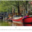 Text: "Lastkahn", "LOVERS canal cruises". Szene: Boote auf einem ruhigen Kanal in einer Stadt mit Bäumen und Brücke.