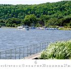 Text: "Essen, Baldeney See", "6". Ein See mit Booten, grüne Ufervegetation und Wald im Hintergrund.