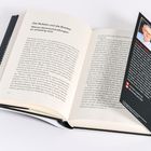 Eine Buchseite mit Überschrift: "Die Mullahs und die Bombe: Warum Atomverhandlungen so schwierig sind". Daneben Infos zu Michael Lüders.