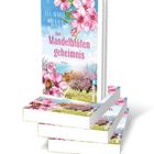 Cover mit rosa Blüten, der Titel "Das Mandelblütengeheimnis" von Eva-Maria Bast, vier gestapelte Bücher.