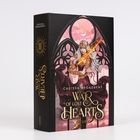 "Carissa Broadbent; War of Lost Hearts; Cover; Kriegerin mit leuchtendem Schwert und Kopfschmuck, gotische Fenster im Hintergrund."