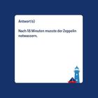 Antwort b) Nach 18 Minuten musste der Zeppelin notwassern. Unten rechts ein kleiner Leuchtturm und ein Schiff.
