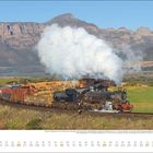 Juni-Kalenderblatt mit Dampflokomotive, die durch eine Landschaft mit Bergen im Hintergrund fährt, während Rauch aufsteigt.
