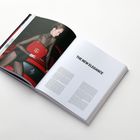 Text: "THE NEW ELEGANCE." Links eine Frau mit einer roten Tasche vor einem Auto.