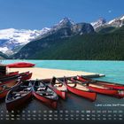 Lake Louise, Banff Nationalpark 6. Kalender mit Kanus am türkisfarbenen See vor Bergkulisse.
