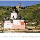 Text: „Kaub, Die Pfalz“ und Kalenderdatum. Szene: Burg auf Insel im Fluss, grüne Hügel im Hintergrund.