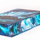 „Khaona – Geburten von Feuer und Eis“ steht auf einem Buchcover mit einem stilisierten, leuchtend blauen Drachen.