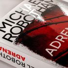 Text: "MICHAEL ROBOTHAM", "ADRENALIN". Buchcover mit rotem Design.