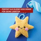„Perfekt als kleine Geschenke für deine Liebsten.“ Ein gehäkelter gelber Stern mit Gesicht, an einem Schlüsselanhänger.