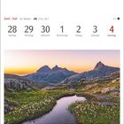 Kalender mit den Daten 28. Juni bis 4. Juli. Darunter eine Landschaft mit Bergen und Blumen im norwegischen Nordland.
