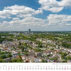 Text: Juli 2027 Kalender. Bonn, Blick von der Godesburg. Weitblick über eine Stadtlandschaft mit vielen Häusern und grünem Wald.