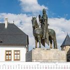 "Schloss Burg und Burg an der Wupper" auf Kalenderseite Juli 2027. Reiterstatue auf Sockel vor Burggebäuden und blauem Himmel.