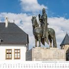 Kalenderblatt Juli 2027. Schloss Burg und Burg an der Wupper. Denkmal eines gepanzerten Reiters vor historischen Gebäuden.