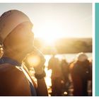 INDIVIDUALITÄT EMPATHIE. Ein Schwimmer mit Badekappe steht im Sonnenlicht, umgeben von anderen Menschen.