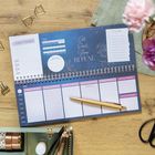 Kalender mit Spiralbindung, Überschrift: "Eat, Read, Sleep, Repeat." Enthält Habit-Tracker und To-do-Liste.