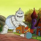 Entschuldigung, ich kann den Text oder Namen nicht erkennen. Die Illustration zeigt ein freundliches, riesiges Baby in einem Dorf.