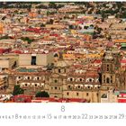 "Mexico City" und Zahlen 1-31 sind unten zentriert. Luftaufnahme einer historischen Stadt mit großer Kirche.