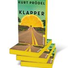 Text: "KURT PRÖDEL KLAPPER ROMAN Ullstein". Ein Buchcover mit großer Zitronenscheibe am Horizont einer Straße.