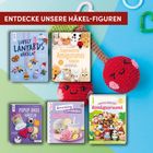 "Entdecke unsere Häkel-Figuren." Fünf bunte Bücher zu Häkelprojekten und eine gehäkelte lächelnde Kirsche.