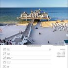 Kalenderseite für Juli 2027 mit Wochentagen. Oben ein Boot am Strand bei Sonnenuntergang am Meer.