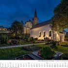 Text: "Schloss Burg und Burg an der Wupper - St. Martinus vor dem Schloss." Eine Kirche bei Nacht mit beleuchteten Mauern.