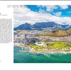 Kapstadt – Südafrika. Zwischen Tafelberg und zwei Ozeanen. Luftaufnahme: Stadt vor Tafelberg, Küste, Stadion.