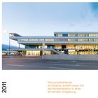 BRG in der Au Innsbruck. 2011. Moderne Architektur, geometrische Form, viele Fenster, abends beleuchtet, klare Linien.