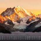 Kalenderblatt für September, darunter ein majestätisches, sonnenbeschienenes Bergpanorama in warmen Orangetönen.