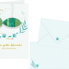 Die Karte zeigt den Text "Alle guten Wünsche zur Erstkommunion" mit einem grünen Fisch aus Pailletten und Pflanzenmotiv.