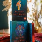 Zwei Bücher mit dem Titel "Echoes of the Wild Souls" von Martyna Szczykłutowicz, eines zeigt eine Eule, das andere einen Wolf.