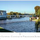 "Spreebogen", darunter Kalenderdaten für September. Landschaft mit Fluss, modernem Gebäude, Brücke und Bäumen im Hintergrund.