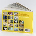 „JAPANISCHE HOLZSCHNITTE, 18 Kunstpostkarten“ steht auf einem gelben Einband mit kleinen Bildern japanischer Kunst.