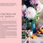 "Polenta-Küchlein mit Safran & Aprikose" steht oben. Links Rezepttext, rechts Blumen und eine Hand, die Küchlein nimmt.