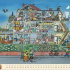 Text: "September". Eine bunte Illustration eines Hauses im Querschnitt mit vielen Details und Aktivitäten in den Räumen.