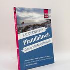 "Kauderwelsch Plattdüütsch. Das echte Norddeutsch. Kummst övern Hund, kümms övern Steert." Strandbild mit Menschen.