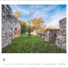 „Cyriakskloster, Coburg, Thüringen.“ Ruinen eines Klosters in herbstlicher Landschaft mit grünem Rasen und Bäumen.