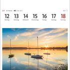 12. Juli bis 18. Juli, Montag bis Sonntag. Sonnenuntergang mit Segelbooten auf ruhigem Wasser bei Wormshöfter Noor.