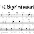 48. Ich geh’ mit meiner Laterne. Volkslied. Notenblätter mit Akkorden. Links oben ein QR-Code und eine kleine Zeichnung.