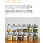 Titel: Pflanzenprofile: 70 Teepflanzen. Darunter Gläser mit getrockneten Kräutern, auf einem Holztisch angeordnet.