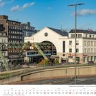 Wuppertaler Schwebebahn - Station Hauptbahnhof. Kalenderblatt für September 2027 darunter. Gebäude und Schwebebahn.