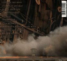 Texte: "CLOSE TO THE BONE, EVERY MAN-ANY MAN, NOT ON YOUR LIFE..." Hintergrund: Industrielle Struktur mit Rauch.