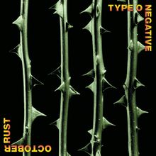 Text oben rechts: "TYPE O NEGATIVE". Text unten links: "OCTOBER RUST". Grüne Dornenstängel auf schwarzem Hintergrund.