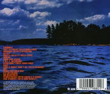 Eine Tracklist in orange: "CRUMBLE...", auf einem See vor Waldufer bei blauem Himmel. Barcode und Logo unten.