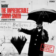 "Bashin' THE UNPREDICTABLE JIMMY SMITH, arrangements by Oliver Nelson." Ein Mann mit Regenschirm lacht im Regen.