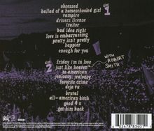 Textliste: Disc 1 enthält Songs wie "obsessed" und "vampire". Disc 2 enthält "friday i'm in love", "just like heaven". Im Hintergrund ist ein Konzert mit lila Licht.