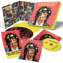 "ROLLING STONES FOREIGN TONGUES" steht auf einer Box und Booklets mit einem expressionistischen Porträt. CDs sind auch zu sehen.