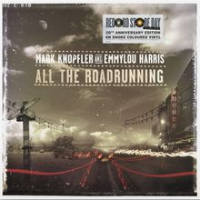 "Record Store Day", "20th Anniversary Edition", "Mark Knopfler and Emmylou Harris", "All the Roadrunning". Eine nächtliche Straßenkulisse mit Casinoleuchtschrift.