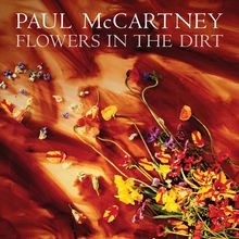 Text: "Paul McCartney, Flowers in the Dirt". Ein buntes Arrangement von Blumen liegt auf erdigem Hintergrund.